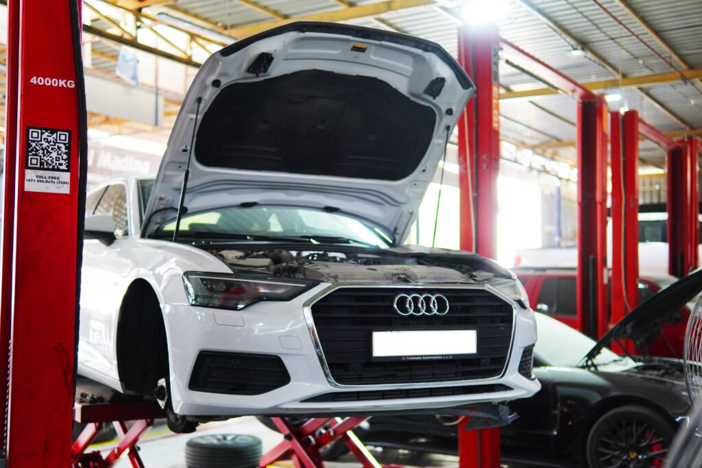 Audi engine repair on a lift at Dar Al Madina Garage Dubai